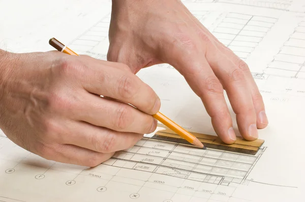 Hand draws a pencil on drawing — Stock Photo #3778224