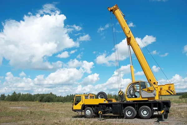 Mobile crane with risen boom outdoors
