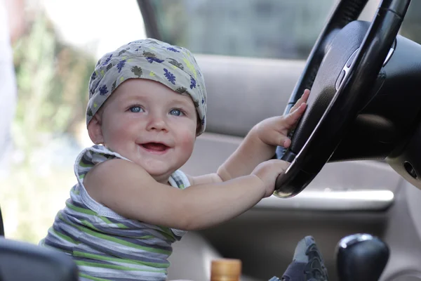Baby poses in car
