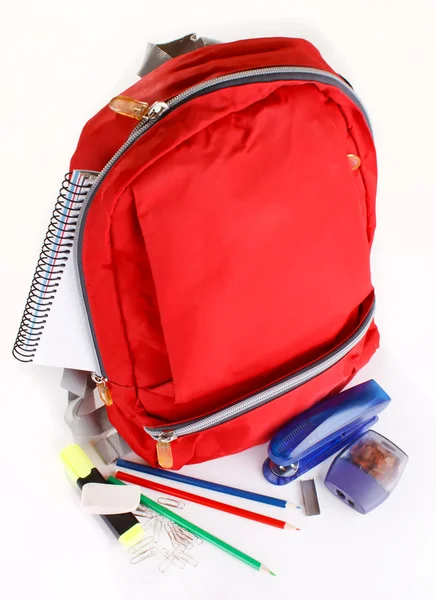 A red school backpack with school supplies
