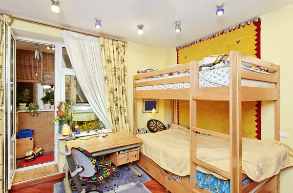 Nursery room interior with two-high wooden bed