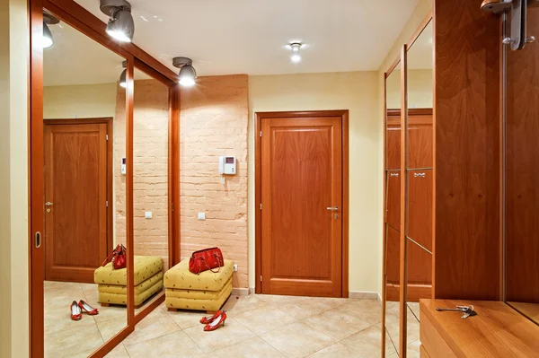 Elegance anteroom interior in warm tones with hallstand
