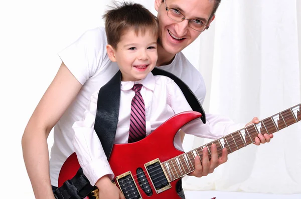 Young father teaches his young son — Stock Photo #4259544