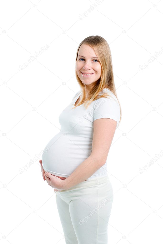 Beautiful pregnant blonde woman in studio shot isolated on white background