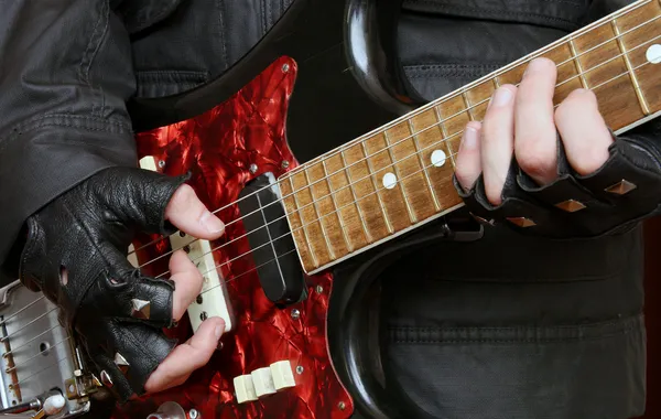 Hands rock musician with a guitar