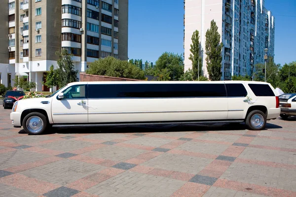 White Wedding Limousine. Ornated with flowers.
