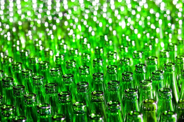 Bunch of green glass bottles. Soft focus.