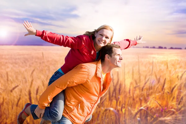 Portrait Young love Couple smiling under Golden wheat ready for