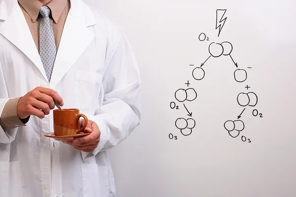 Scientist holding a cup of coffee