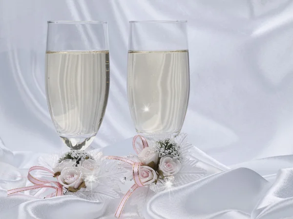 Glasses with champagne and wedding decor by Galyna Semenko Stock Photo