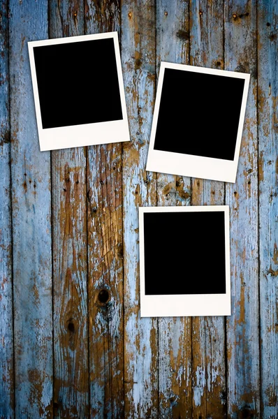 Three Blank Photos on Grungy Background