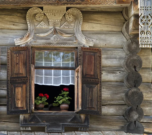 Window of old, wooden house in the countryside