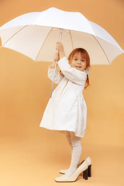 Funny child with umbrella