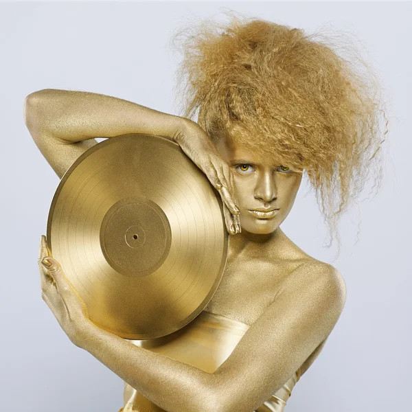Golden girl with vinyl