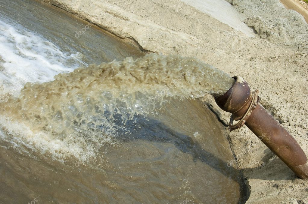 Dirty water flows from a pipe. — Stock Photo © kotomiti 2985294