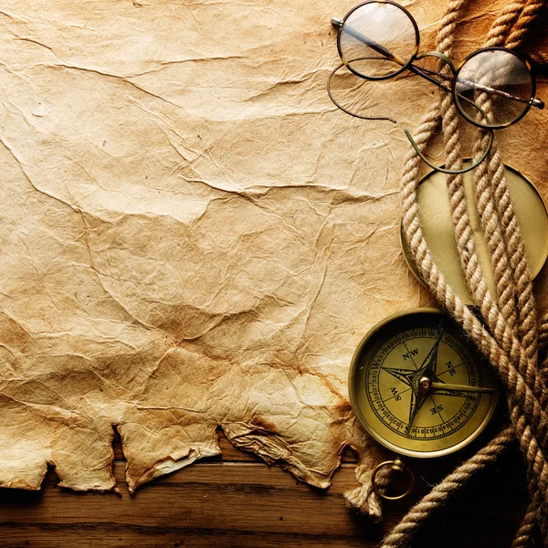 Compass, rope and glasses