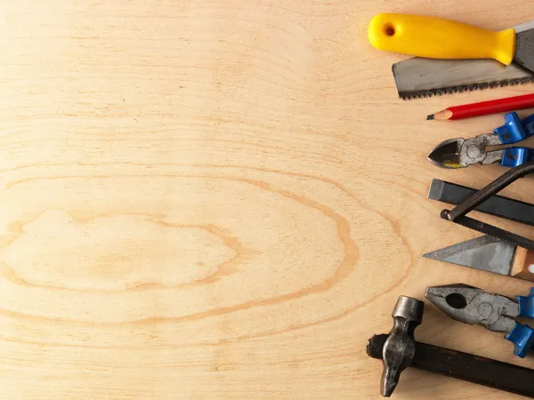 Tools on a wooden background