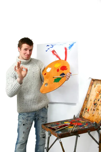 The young artist draws a picture