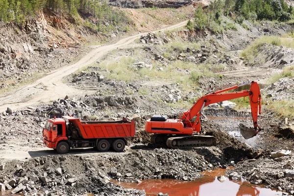 Dump Truck and Excavator in a Quarry