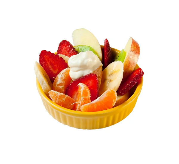 Fruit salad with yogurt in yellow plate