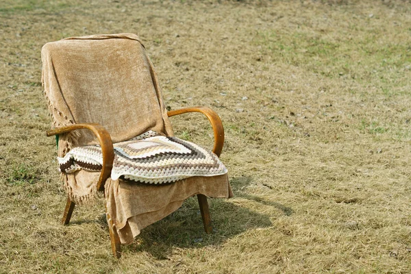 Old-fashioned garden chair and pillow