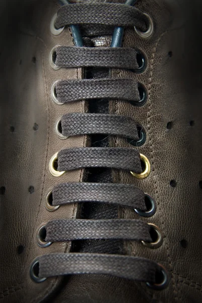 Close-up laces on the brown boots
