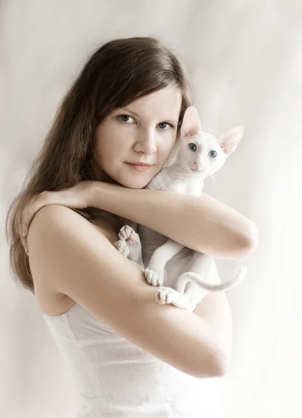 The girl with a white kitten
