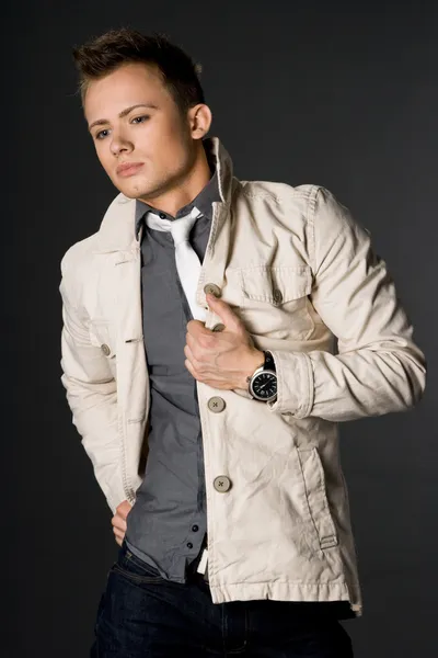 Attractive businessman in beige jacket