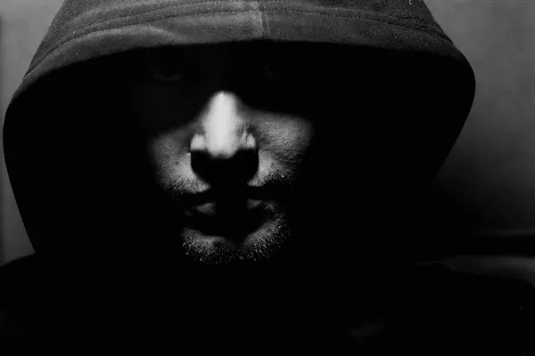 Monochrome picture of a guy in a hood