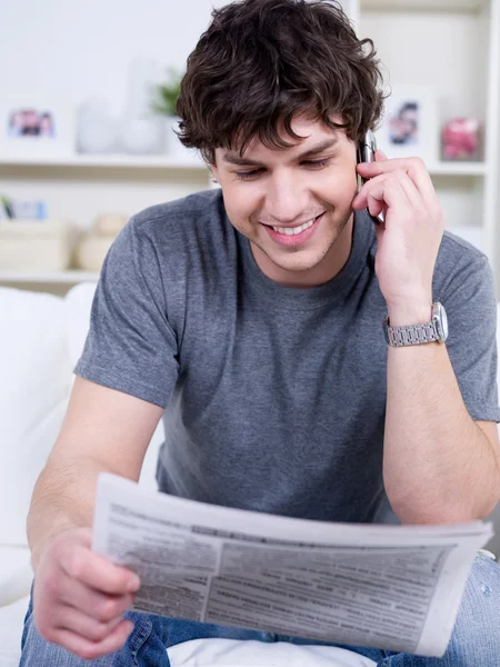 Happy man with newspaper