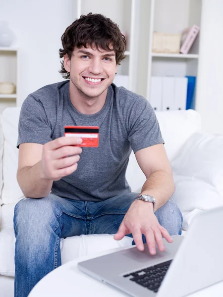 Handsome man with credit card