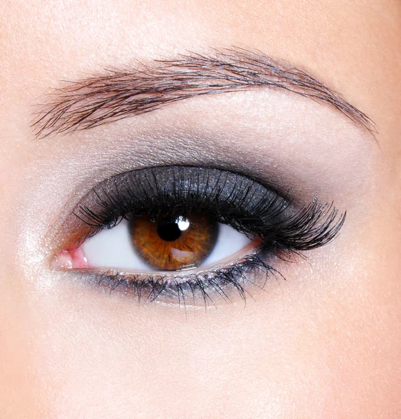 Eye with dark brown glamour make-up