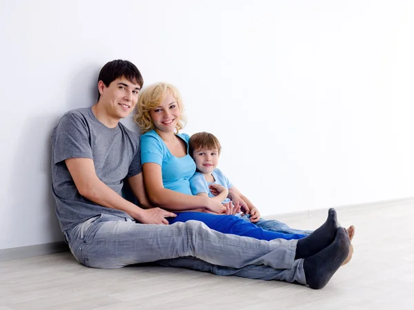 Family with son in empty room