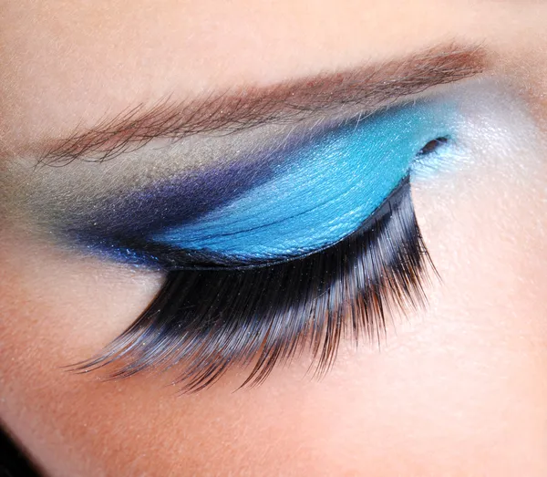 Fashion make-up with long false eyelashes