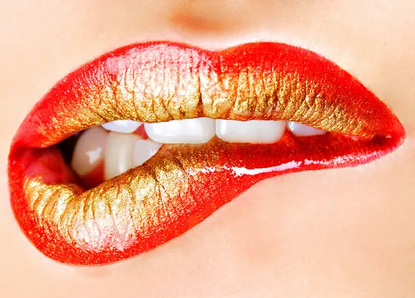 golden makeup of female lips