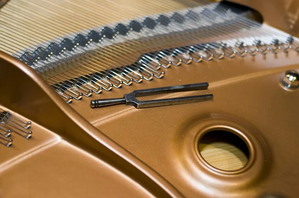 Tuning fork on a piano