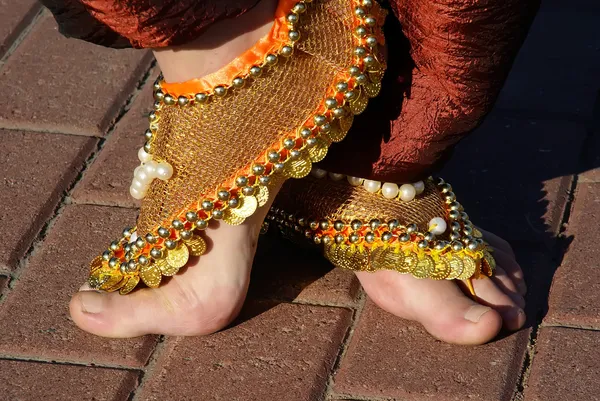 Feet and decorations of the Indian woman