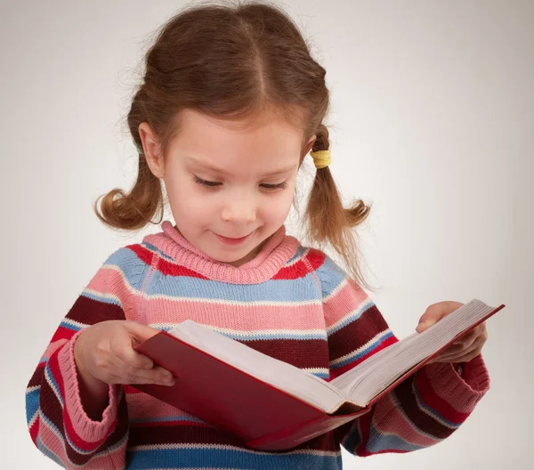 Girl with bows reads book