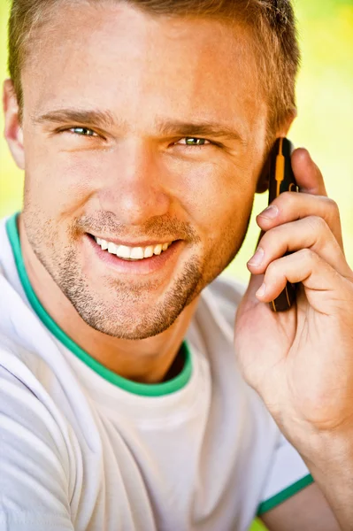 Young man speaks on phone