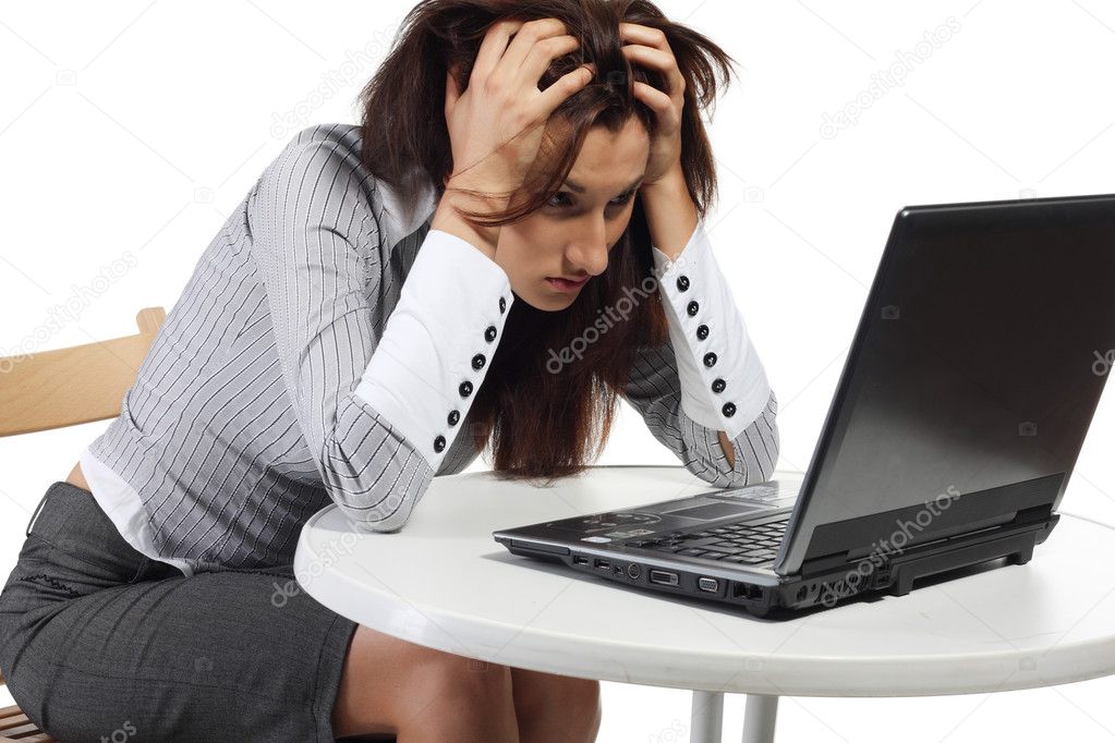 Tired women sitting with computer by Sergii Salivon - Stock Photo