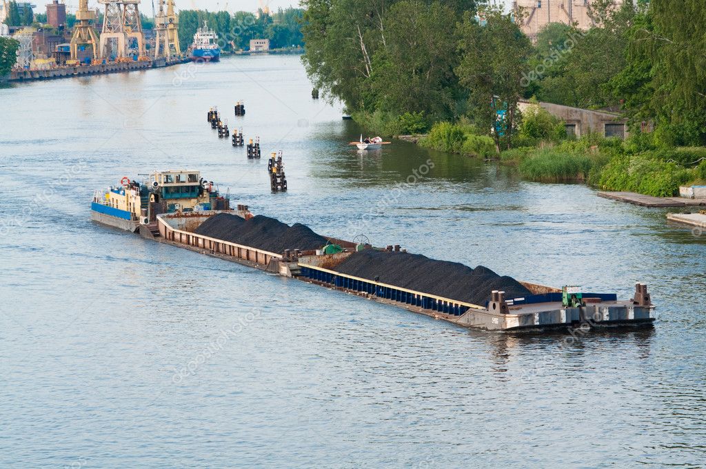 Coal barge sailing on the river — Stock Photo © tarczas #3670488