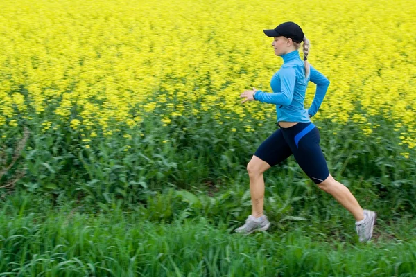 Woman running outdoors, motion blur