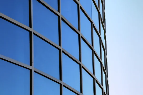 Curved exterior windows of a modern commercial office building