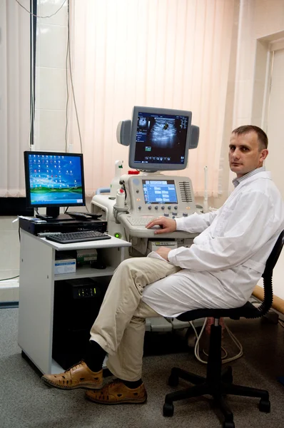 Medical doctor during ultrasound investigation