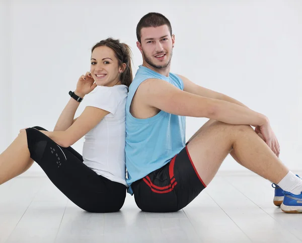 Happy young couple fitness workout and fun