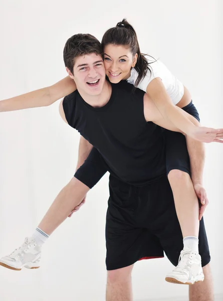 Happy young couple fitness workout and fun