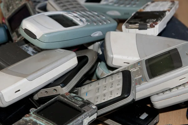Close-up on a mobile phones graveyard