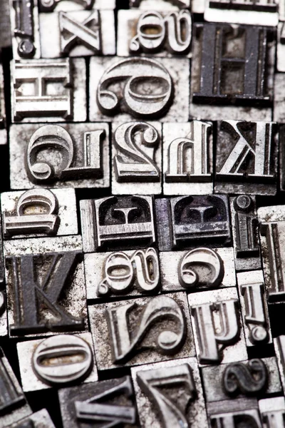 A mix of vintage letterpress characters
