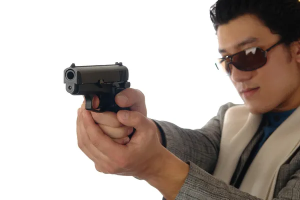 Asian man holding gun