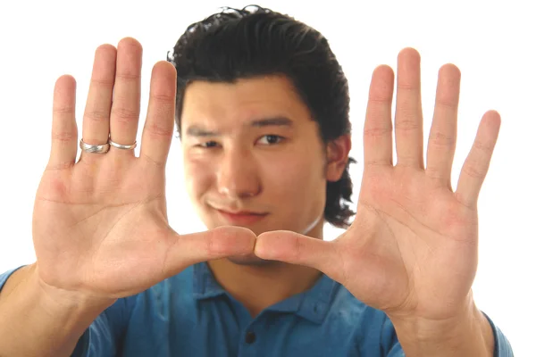 Asian man holding hand-frame